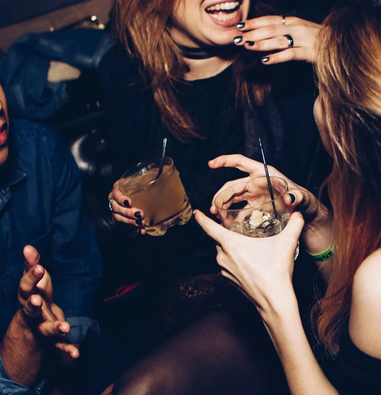 Guests toasting drinks at a corporate holiday party